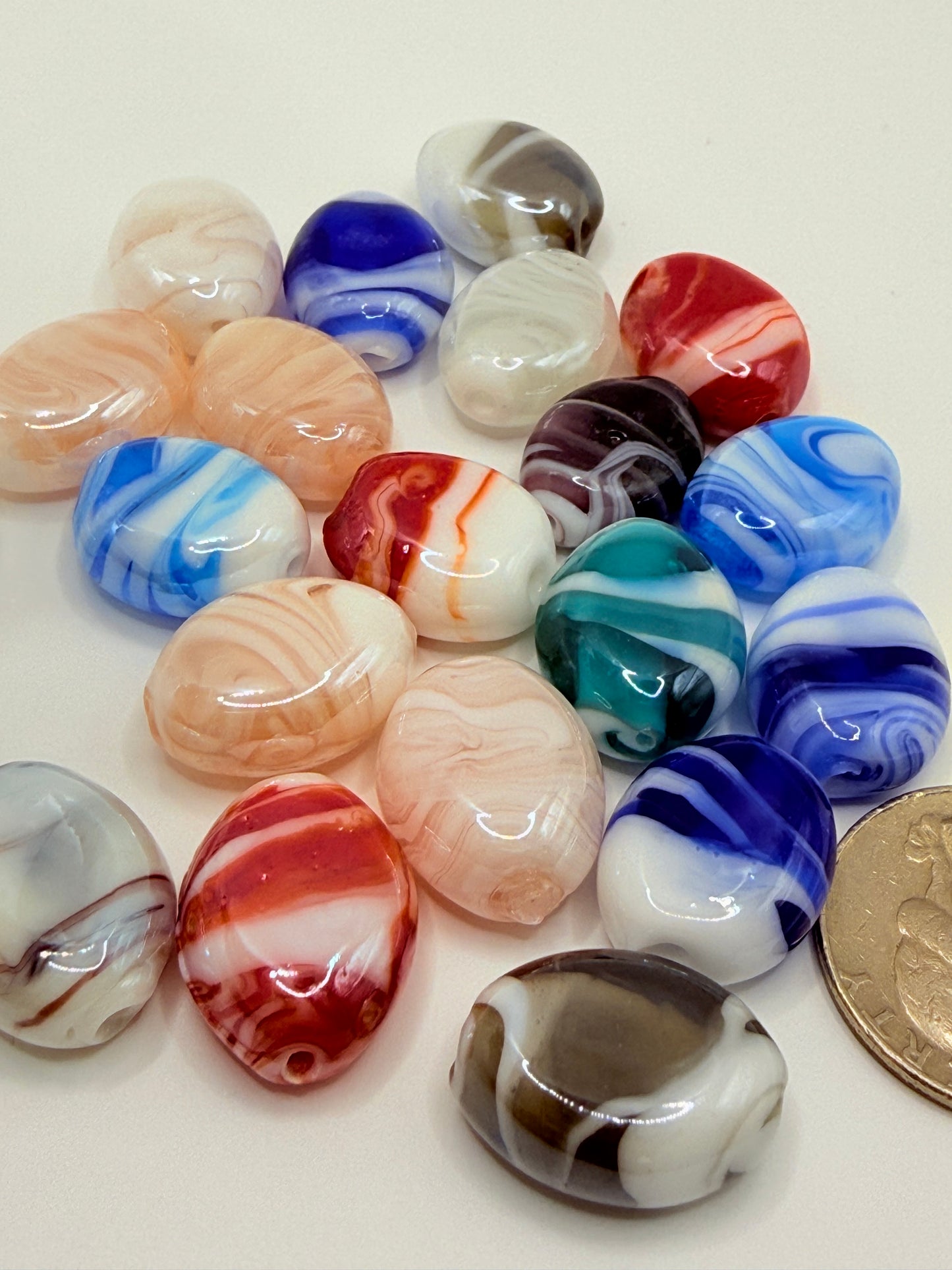 Flat oval beads.  Highly polished.